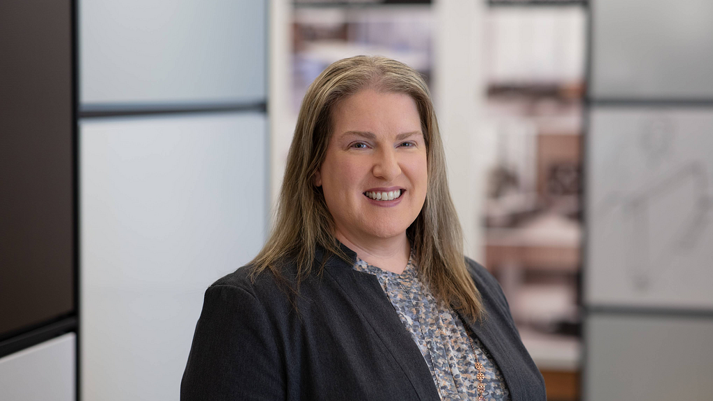 A woman smiling at the camera.